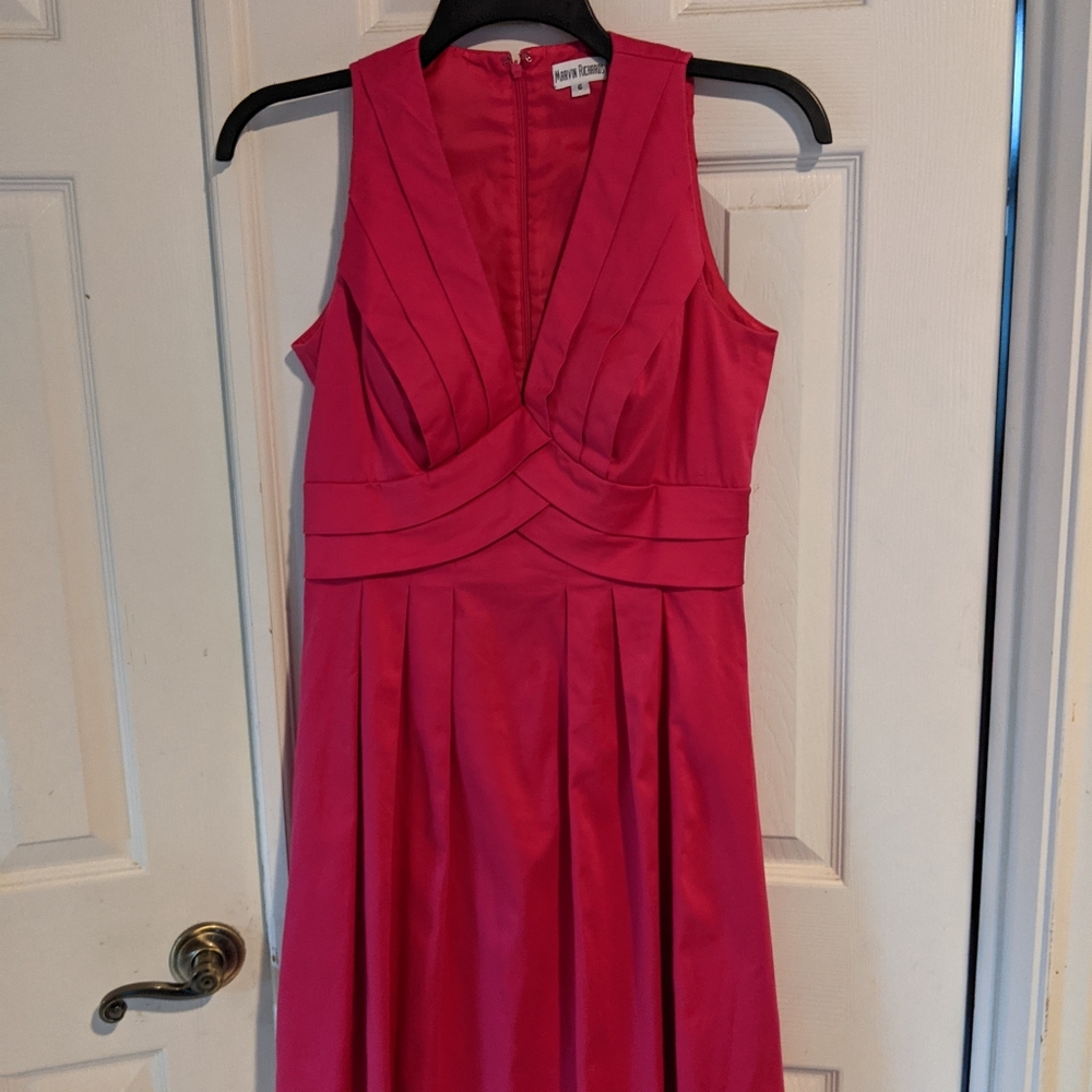 A vintage flamingo pink pleated dress. Knee Length